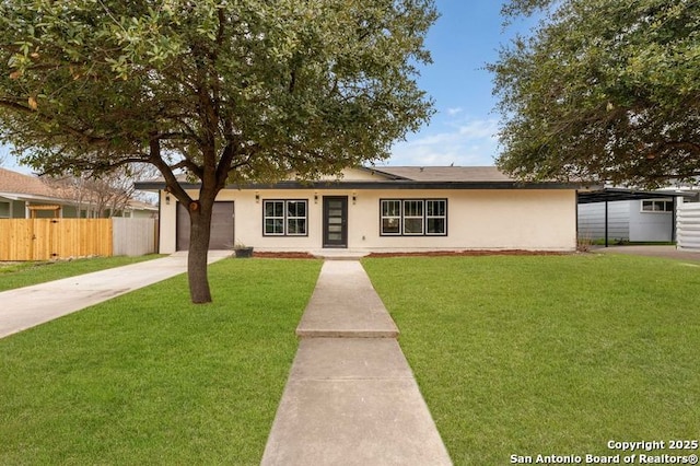 ranch-style house featuring concrete driveway, a front yard, fence, and stucco siding