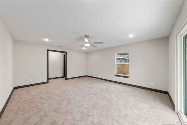 unfurnished room with recessed lighting, light carpet, ceiling fan, and baseboards