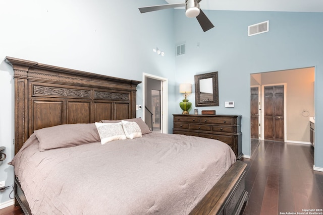 bedroom featuring dark wood-style floors, a ceiling fan, visible vents, and baseboards