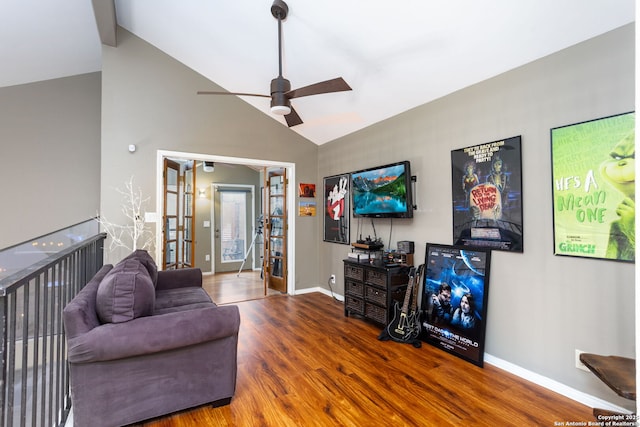 living room featuring ceiling fan, wood finished floors, baseboards, vaulted ceiling, and french doors