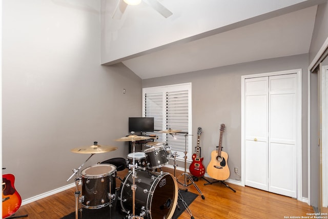 recreation room featuring ceiling fan, baseboards, and wood finished floors