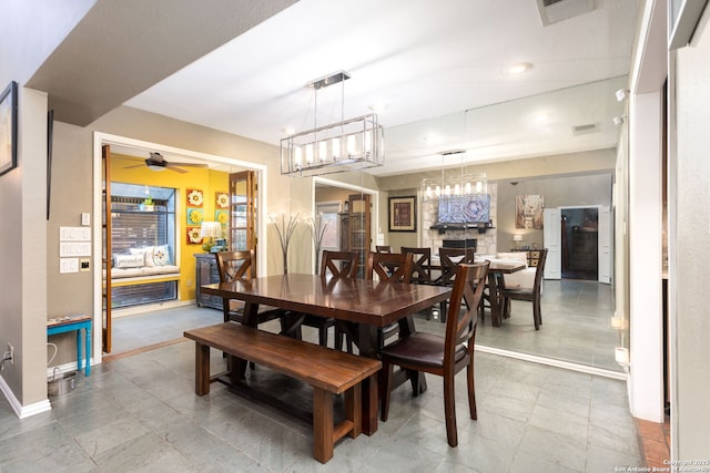 dining area featuring a ceiling fan, visible vents, and baseboards