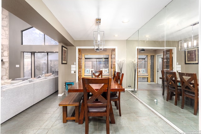 dining space with an inviting chandelier