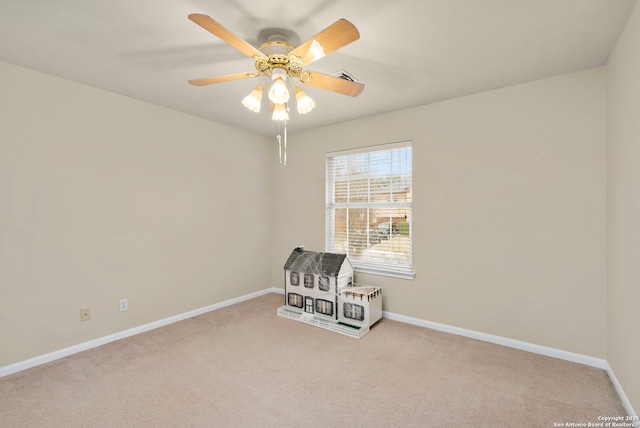 interior space featuring a ceiling fan, light carpet, visible vents, and baseboards