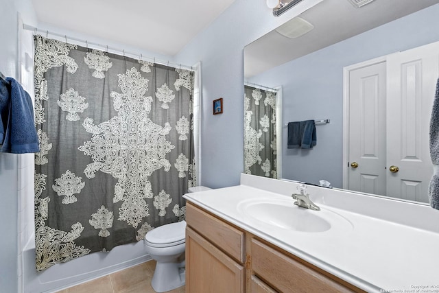 bathroom with toilet, tile patterned flooring, shower / bath combo, and vanity