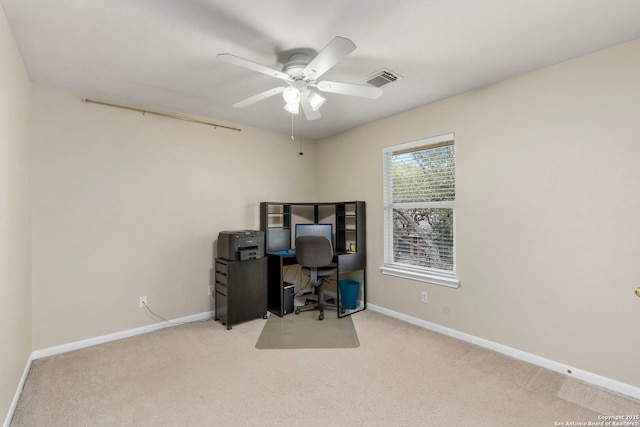 home office with light carpet, ceiling fan, visible vents, and baseboards