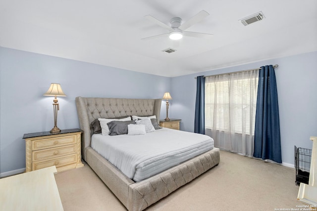 bedroom with light carpet, baseboards, visible vents, and ceiling fan