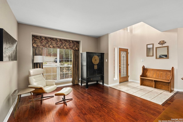 sitting room with light wood finished floors and baseboards