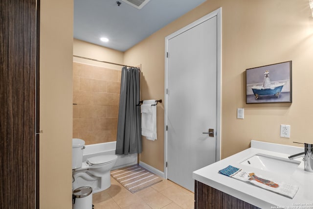 bathroom with toilet, visible vents, tile patterned flooring, and vanity