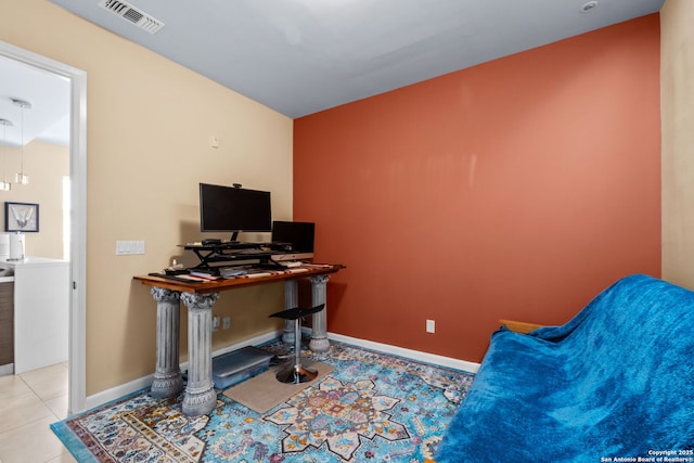 office space featuring visible vents, baseboards, and light tile patterned flooring