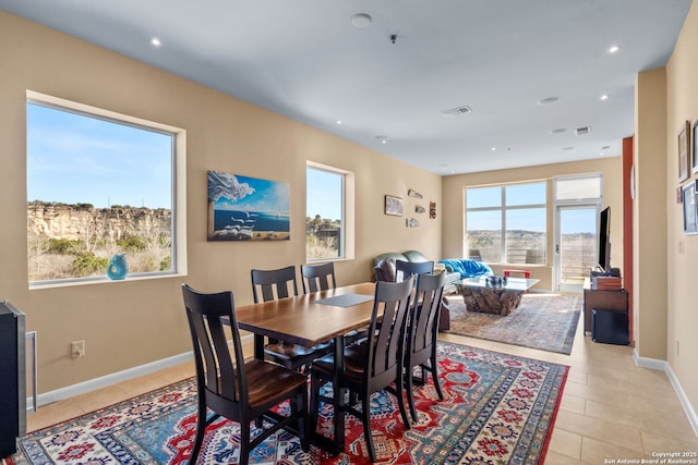 dining room featuring recessed lighting, visible vents, baseboards, and light tile patterned floors