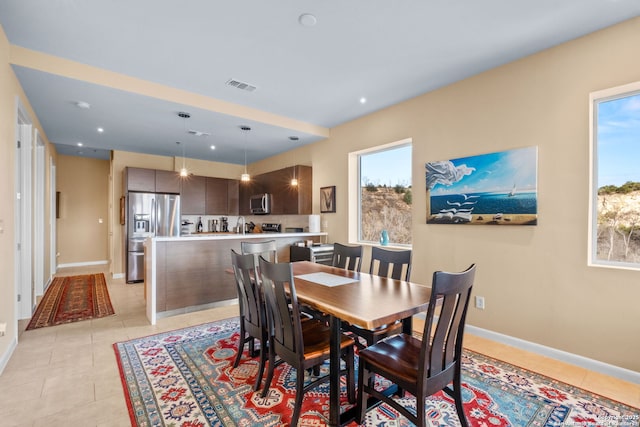 dining area featuring recessed lighting, light tile patterned flooring, visible vents, and baseboards