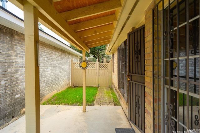 view of patio / terrace featuring a gate and fence