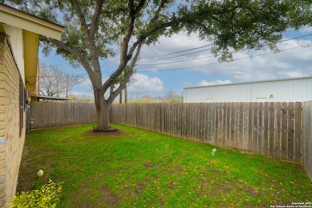 view of yard with a fenced backyard