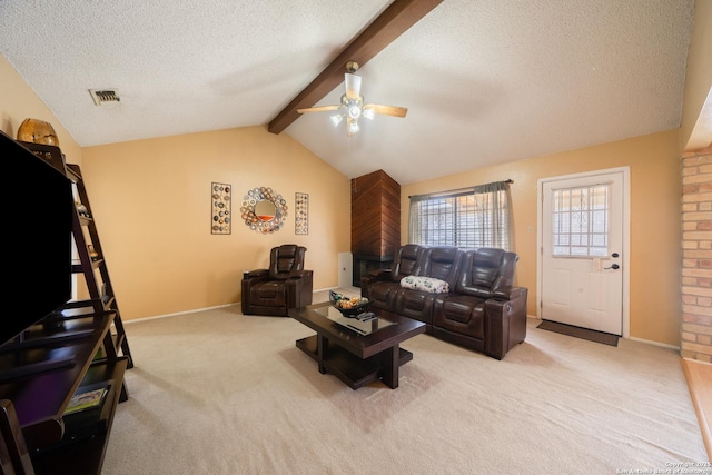 living area with light carpet, lofted ceiling with beams, a textured ceiling, and visible vents