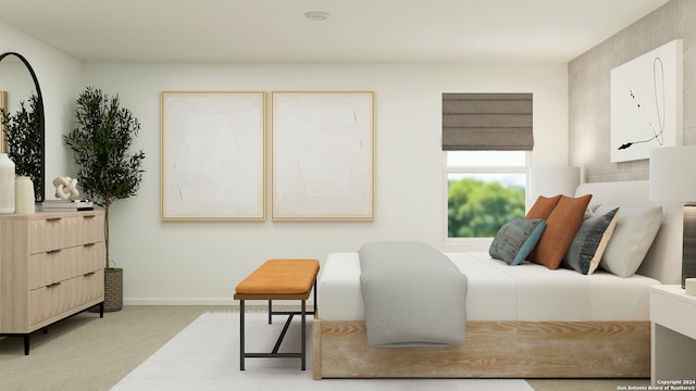 bedroom featuring light carpet and baseboards