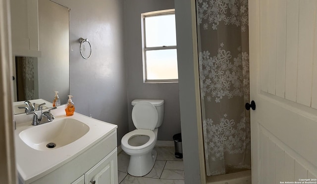 full bathroom with toilet, vanity, baseboards, marble finish floor, and a shower