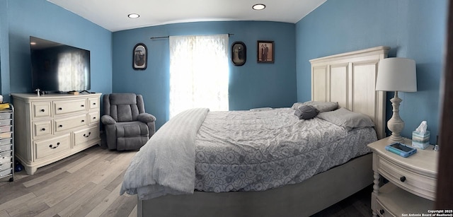 bedroom with light wood-style floors and recessed lighting