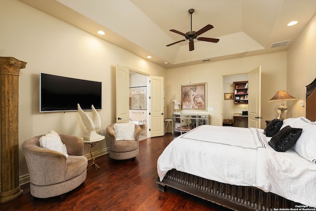 bedroom featuring a tray ceiling, dark wood-style flooring, visible vents, and recessed lighting