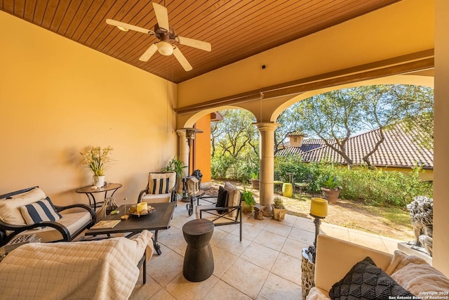 view of patio featuring outdoor lounge area, a fenced backyard, and a ceiling fan