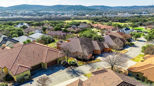 drone / aerial view with a residential view and a mountain view