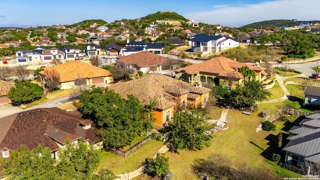 birds eye view of property with a residential view