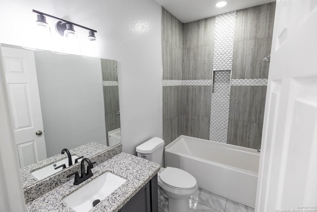 bathroom with toilet, marble finish floor, shower / washtub combination, and vanity