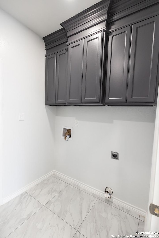 washroom featuring hookup for a washing machine, baseboards, marble finish floor, cabinet space, and electric dryer hookup