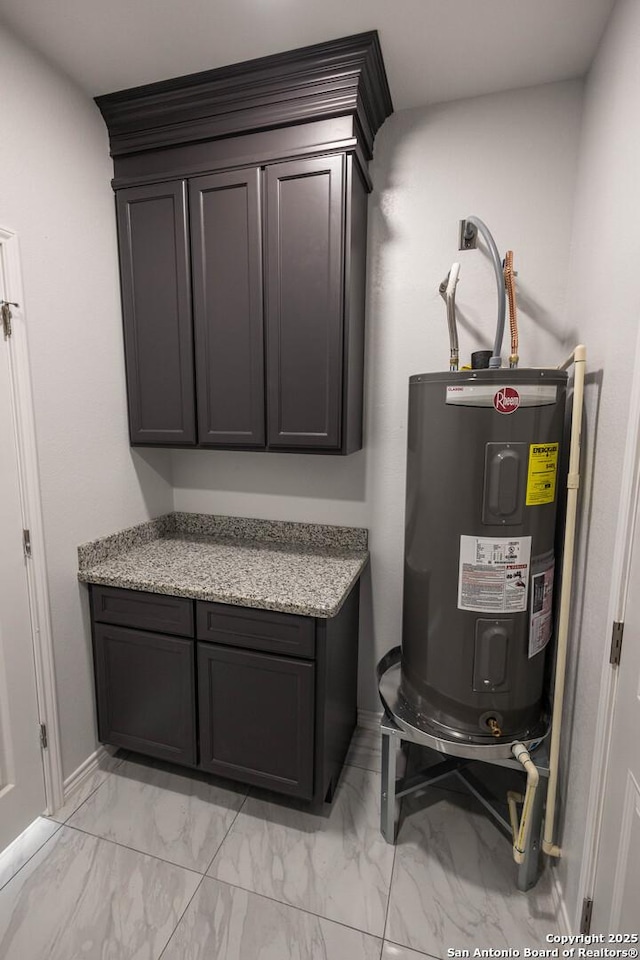 utility room featuring electric water heater