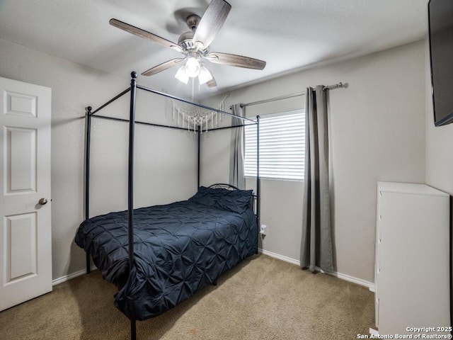 bedroom featuring carpet floors, ceiling fan, and baseboards