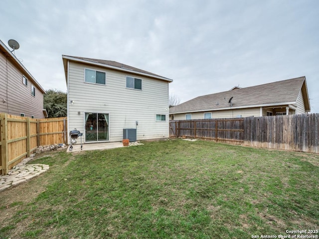 back of house featuring a patio area, a fenced backyard, cooling unit, and a lawn