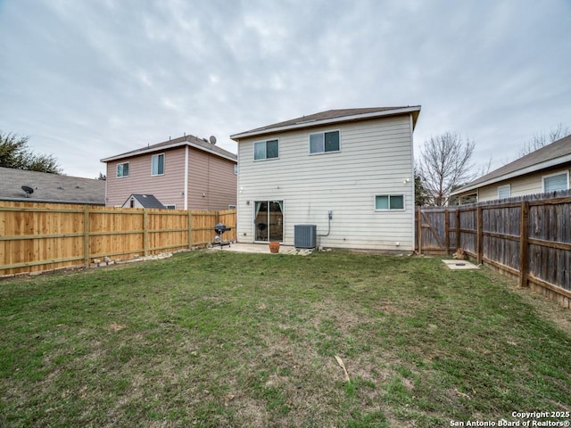 back of property featuring central AC unit, a lawn, a patio area, and a fenced backyard