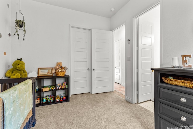 bedroom featuring light carpet and light tile patterned floors