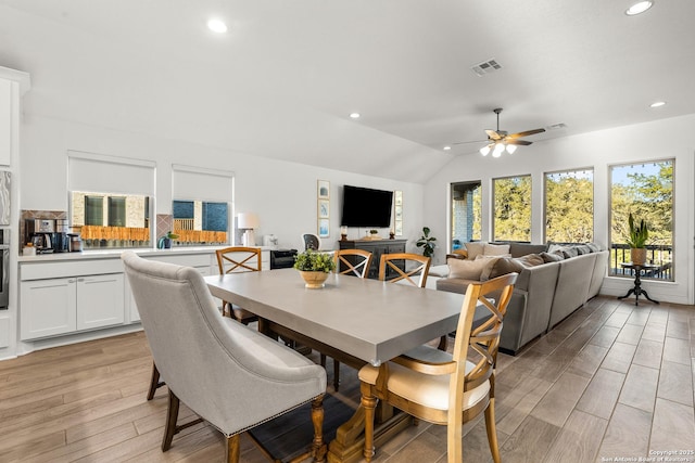 dining area with lofted ceiling, light wood-style floors, visible vents, and recessed lighting