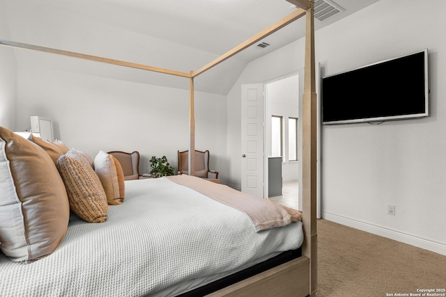 bedroom with carpet floors, visible vents, vaulted ceiling, and baseboards