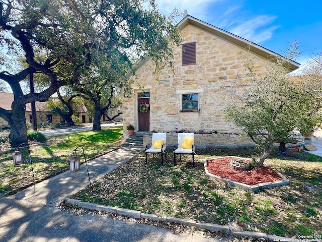 view of front of home with stone siding