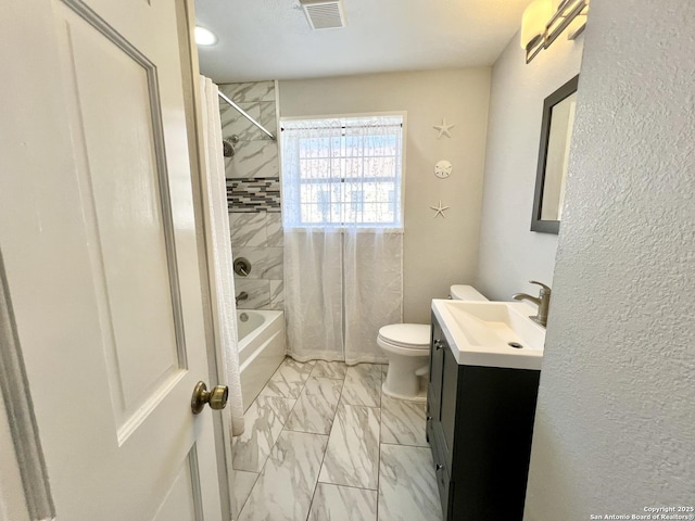 bathroom with toilet, vanity, visible vents, marble finish floor, and shower / bath combo with shower curtain