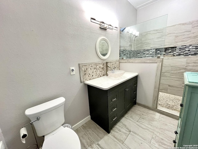 full bath with a walk in shower, toilet, vanity, baseboards, and marble finish floor