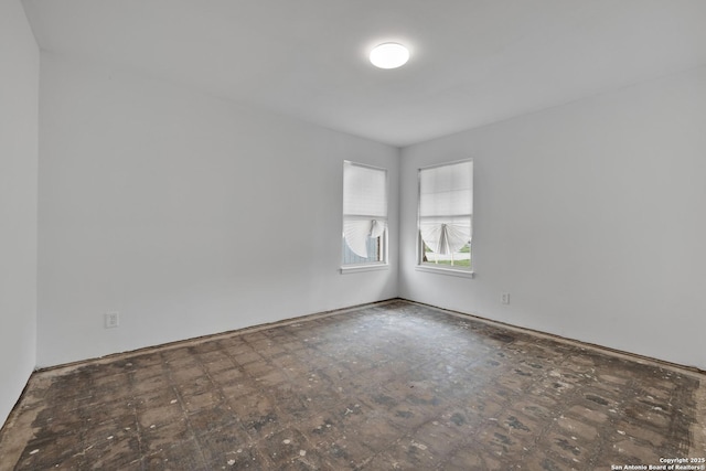 unfurnished room with dark floors