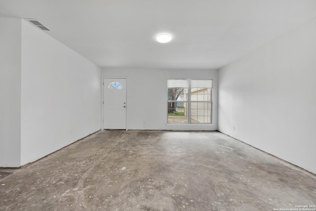 interior space featuring visible vents and unfinished concrete floors