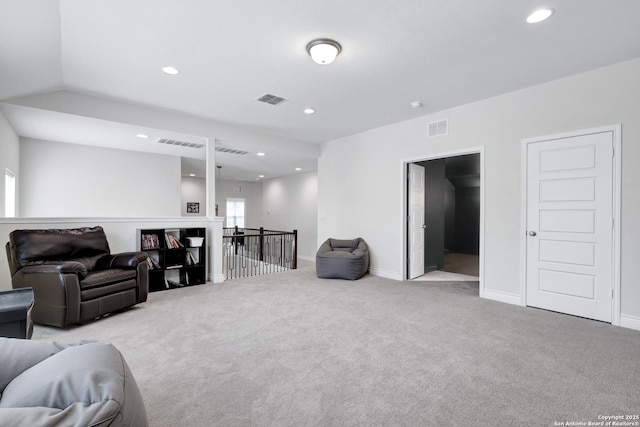 living room featuring baseboards, recessed lighting, visible vents, and light colored carpet