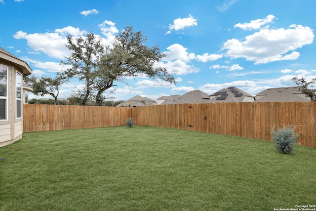 view of yard featuring a fenced backyard