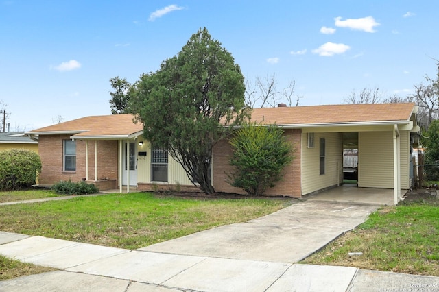 ranch-style home featuring driveway, a front lawn, an attached carport, and brick siding