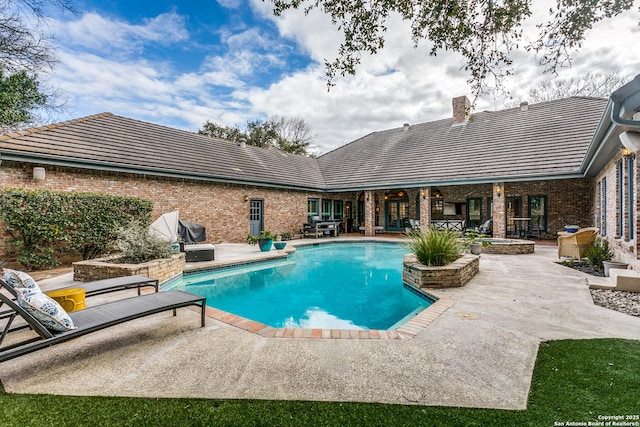 pool with a patio area