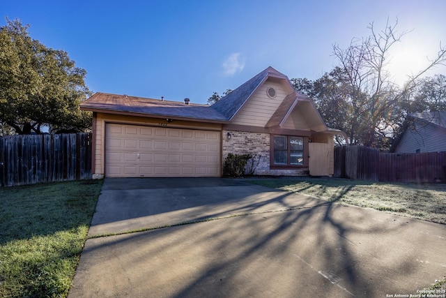 view of front facade with a garage, concrete driveway, brick siding, and fence