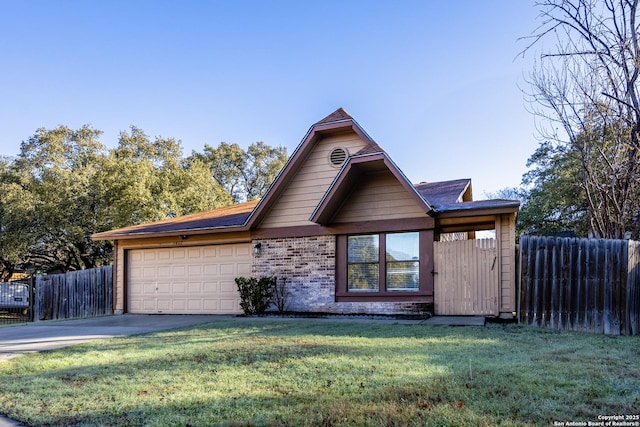 view of front of home with a garage, a front yard, concrete driveway, and fence