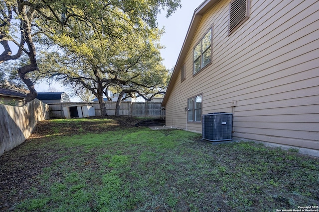 view of yard featuring cooling unit and a fenced backyard