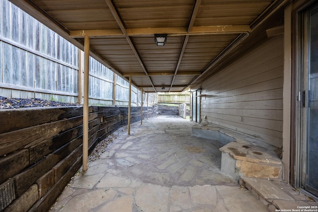 view of patio with an outbuilding and an exterior structure