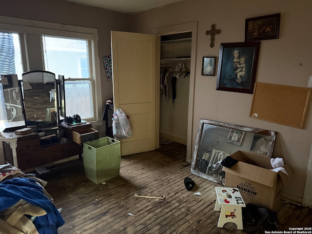 bedroom with a closet and wood finished floors