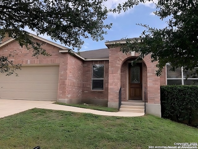 view of front of property featuring concrete driveway, brick siding, a front lawn, and an attached garage